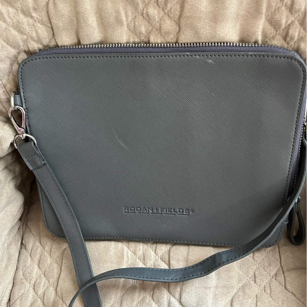 Rodan & Fields grey crossbody bag